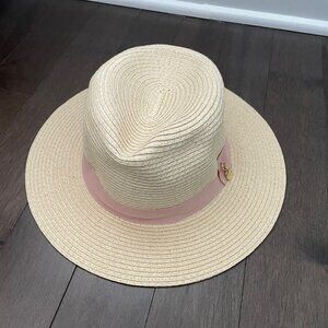 Melissa Odabash cream toned fedora hat with pale pink ribbon band and gold charm